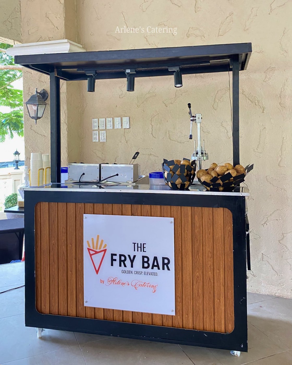 Arlene's Catering's own branded mobile Fry Bar cart at a real event